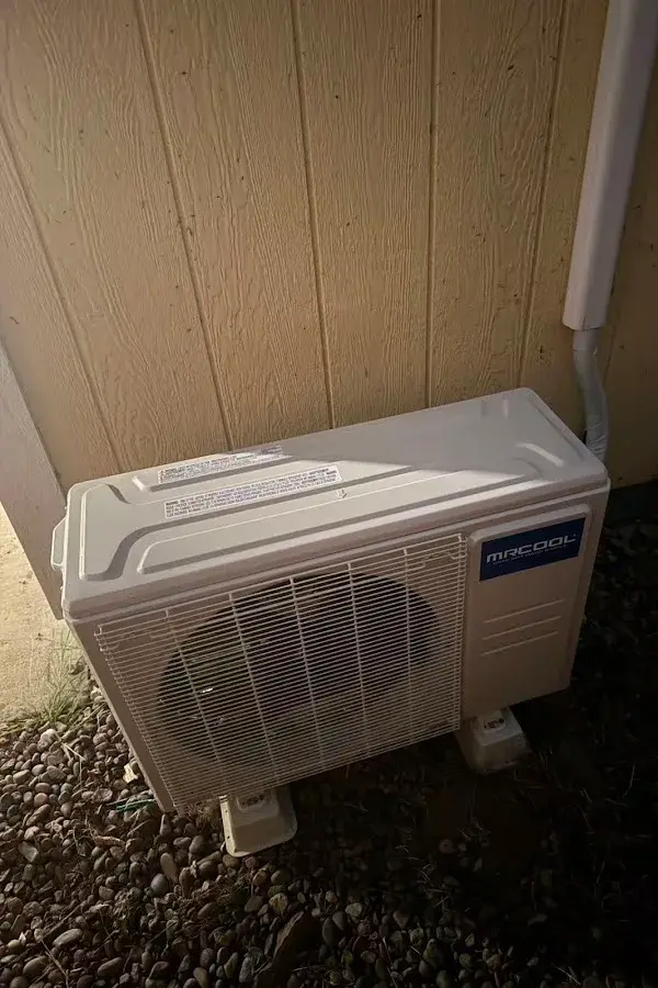 Outdoor mini-split condenser installed beside a home, shared by customer Audrey Zhang