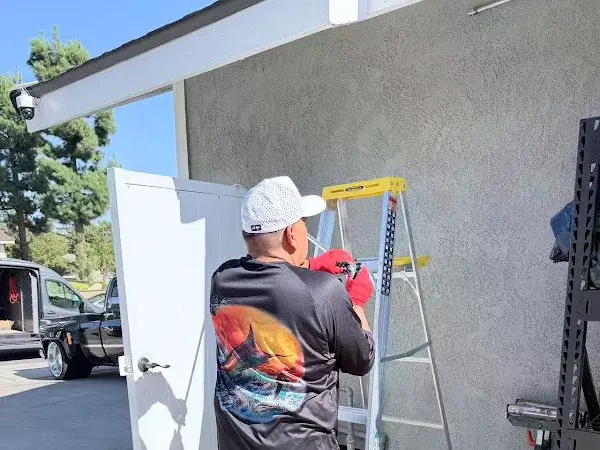 Technician working on a garage mini-split installation, shared by customer Shawn M